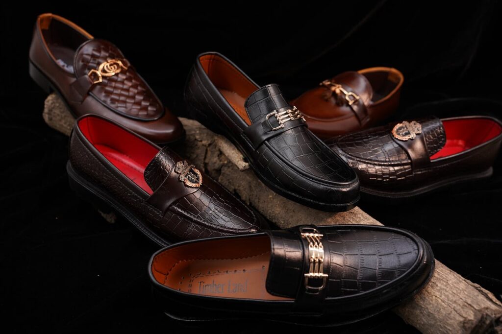 A collection of elegant leather loafers displayed artistically with rich textures and colors.